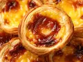 Pasteles de nata dorados y crujientes, listos para disfrutar. Una delicia de la pastel de nata recipe.